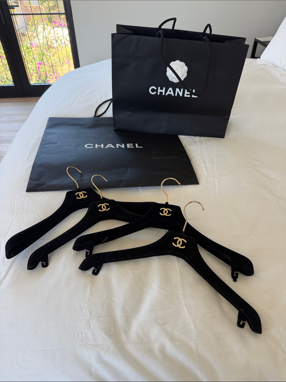 CHANEL Black Velvet Hangers with Gold CC Accents & shopping bags